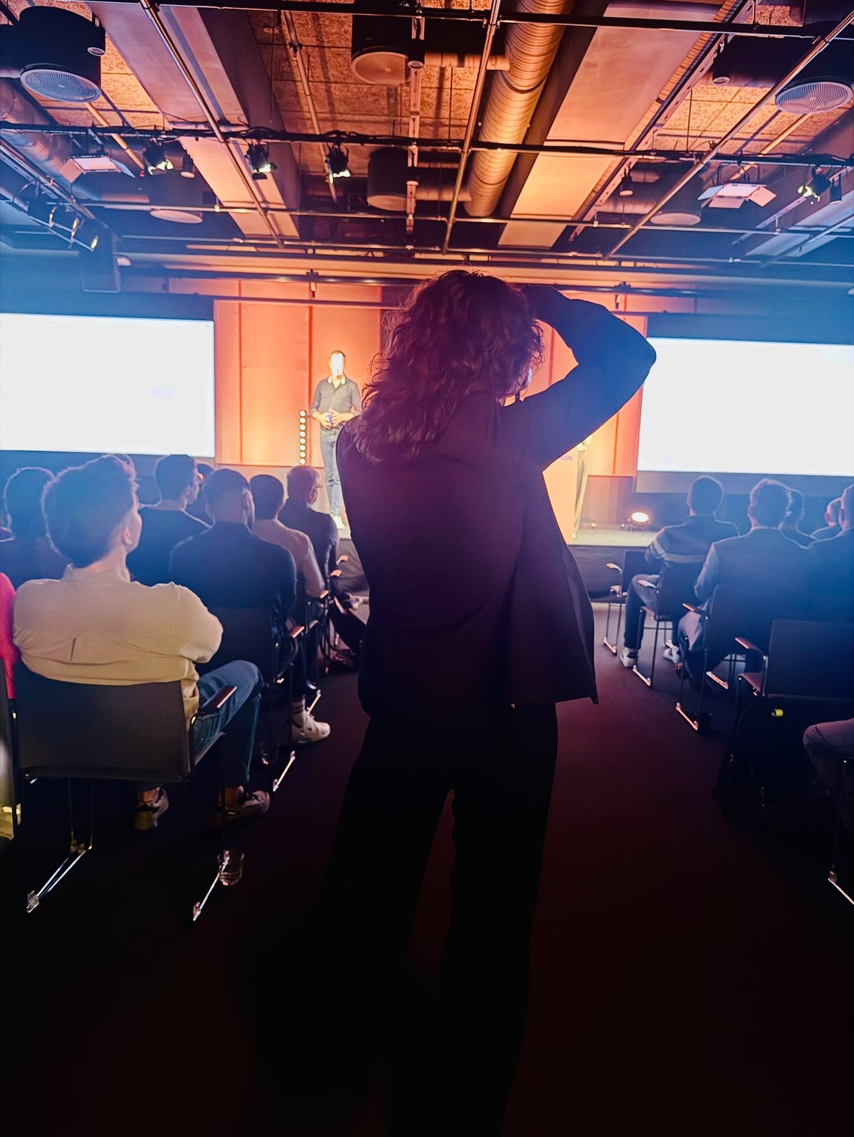 Nikola photographing a keynote from the audience